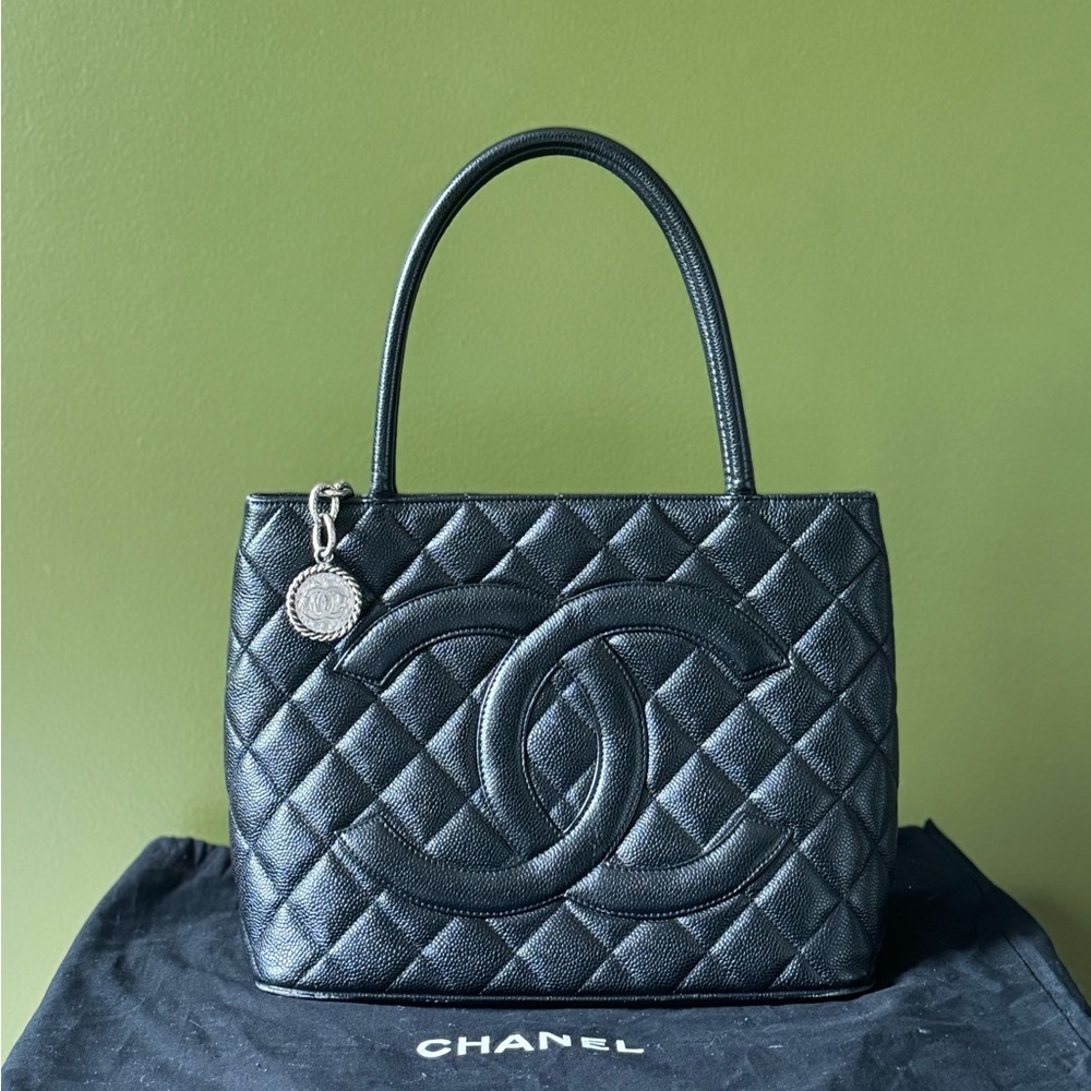 Authentic Chanel Black Quilted Shoulder Bag with Silver Charm